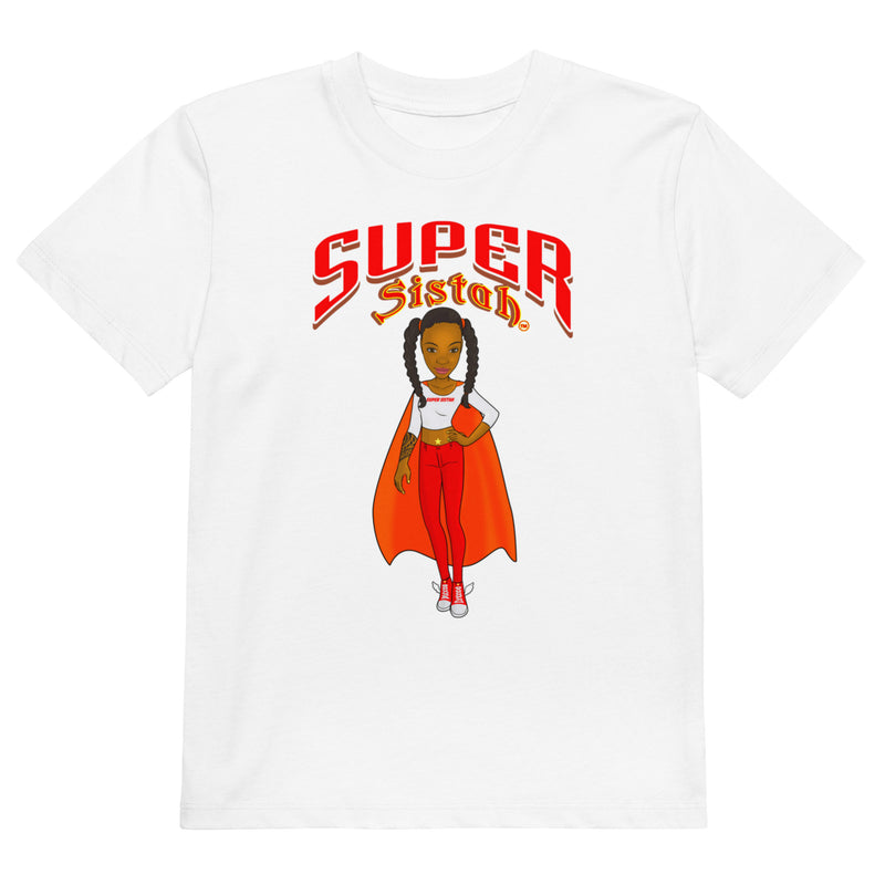 A white short-sleeve crewneck t-shirt featuring a graphic print of a cartoon girl with braids wearing a red cape and matching red pants, with the text 'SUPER Sistoh.' printed above her in red and orange.