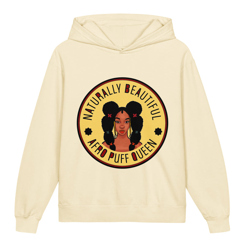 A cream-colored pullover hoodie featuring a circular graphic print on the chest. The graphic depicts a stylized portrait of a woman with large black bubble buns and the text 'NATURALLY BEAUTIFUL AERO PUFF QUEEN' in brown and black lettering.